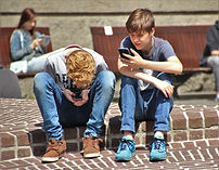 cw - teens boys using cell phones pokemo